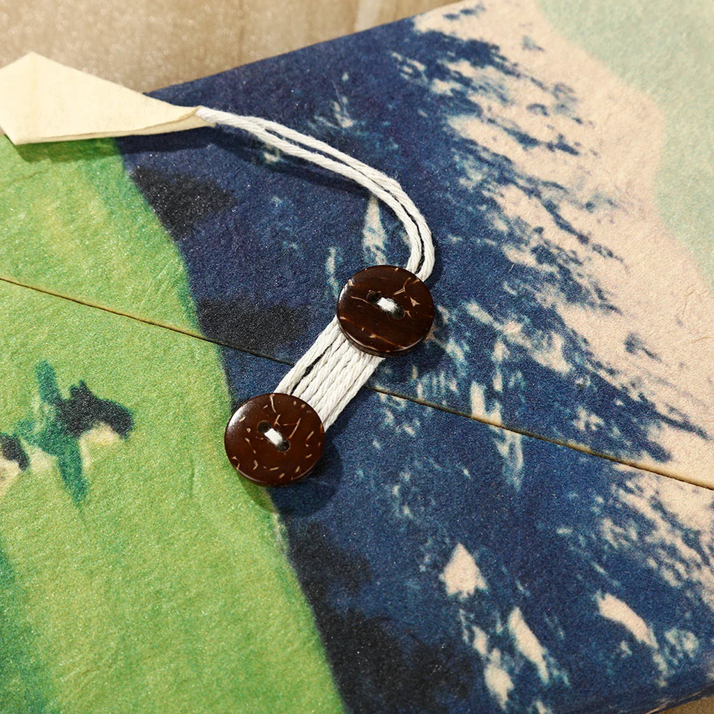 Cord closure detail on the blue Ins Nepal Journal cover.