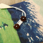 Cord closure detail on the blue Ins Nepal Journal cover.