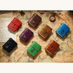 Pocket Traveler Wrap Journals arranged in assorted colors.