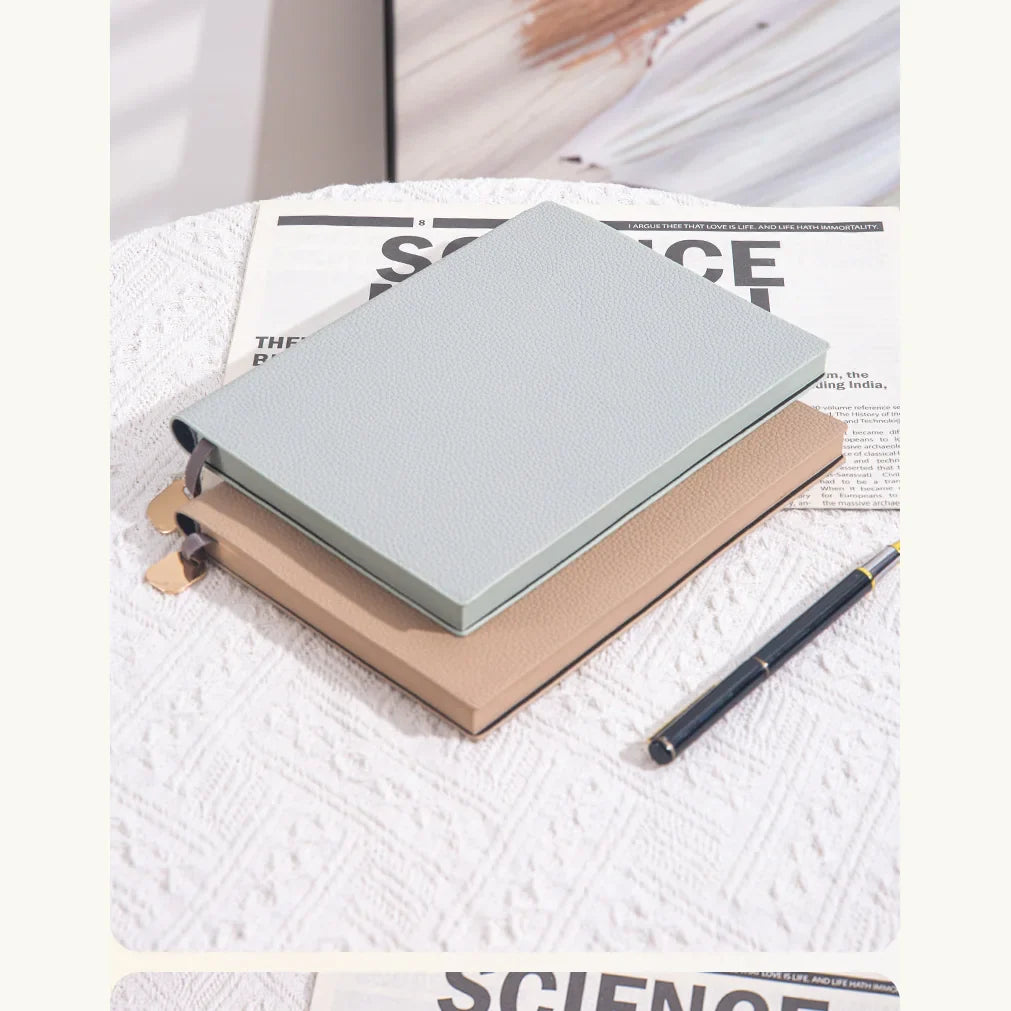 Soft Pebble A5 notebook shown with a pen for scale.